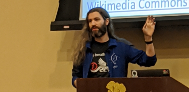 Brian Meeker gesturing at a slide from behind a lectern while presenting at CodeMash 2020